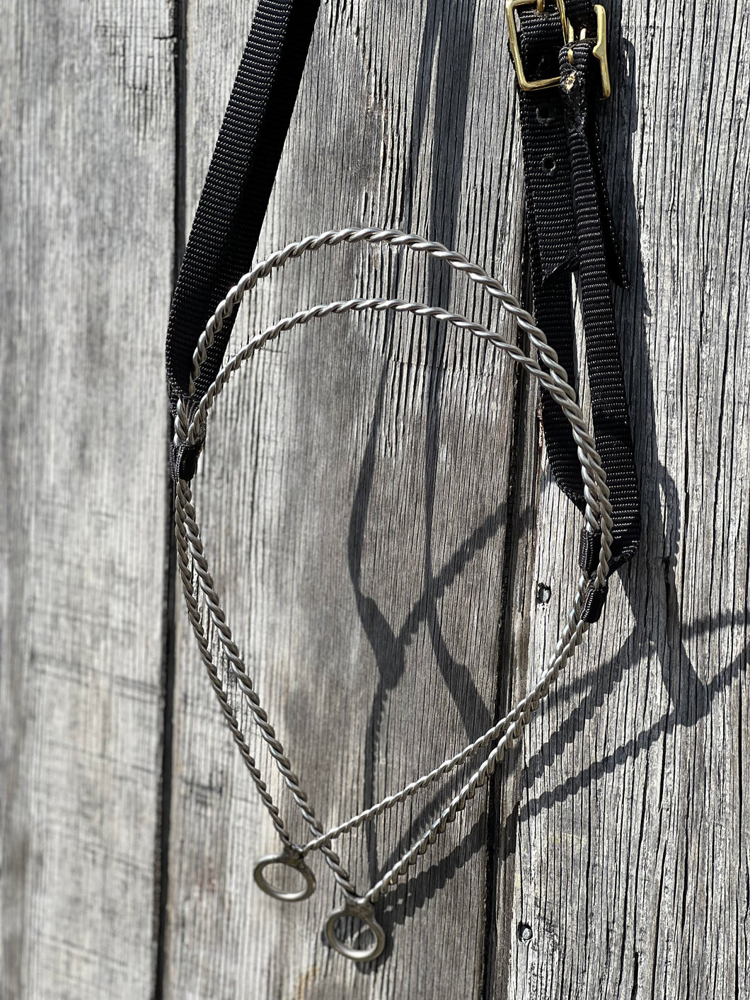 Twisted wire tie down